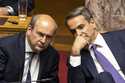 Greece's Prime Minister Kyriakos Mitsotakis, right, speaks with National Economy and Finance Minist…