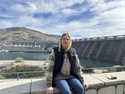 Former Grand Coulee Dam worker, Stephanie Duclos, sits in front of the Grand Coulee Dam on Friday, …