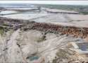 This image taken from video Wednesday, February 19, 2025, shows a breach at a tailing dam at a Sino…